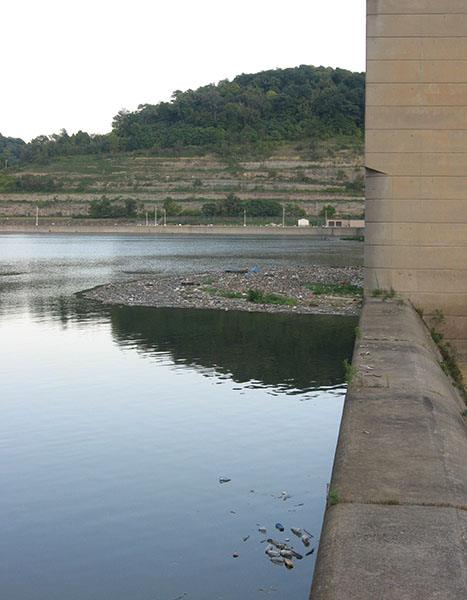 reflections in back of the dam